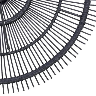 Artisanal black rattan hanging light with sculptural funnel shape and natural texture.