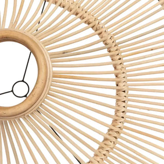 Natural handwoven rattan pendant light with a sculptural funnel silhouette and airy woven texture.