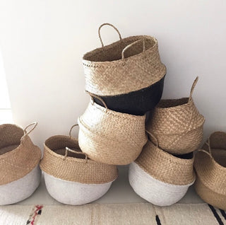 Handwoven natural seagrass storage baskets with handles, perfect as stylish hanging baskets, pot planters, or decorative storage solution. These eco-friendly, two-tone baskets add a touch of natural home décor while keeping your space organized. Shop handcrafted storage baskets at our natural homeware store.