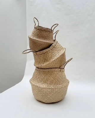 Handwoven natural seagrass storage baskets with handles, perfect as stylish hanging baskets, pot planters, or decorative storage solution. These eco-friendly, two-tone baskets add a touch of natural home décor while keeping your space organized. Shop handcrafted storage baskets at our natural homeware store.
