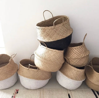 Two-tone handwoven seagrass storage basket in white and natural, ideal for boho or minimalist home organization and decor.