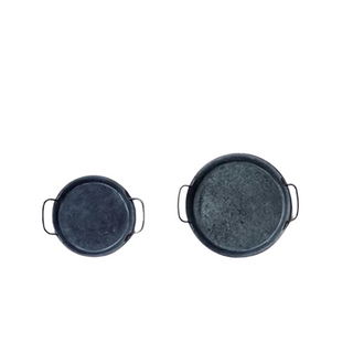 Set of two rustic handmade iron serving plates with handles, ideal for bread, cheese, or decorative farmhouse table styling.