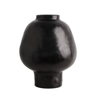 Black ceramic sculptural vase with a minimalist design, available in two sizes that can be styled together. The vase features a creative, artistic shape and a sleek black finish, perfect for adding a bold, statement look to any modern or contemporary interior.