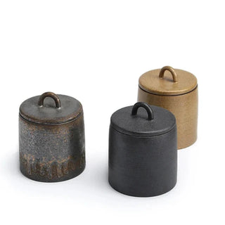 Set of three handcrafted Japanese stoneware storage jars with lids, featuring earthy tones and a rustic finish. Perfect for kitchen organization, these ceramic canisters provide airtight storage for tea, coffee, spices, or pantry essentials. A stylish and functional addition to natural homeware and minimalist decor.