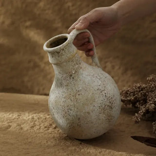 Minimalist ceramic vase with textured surface and soft organic form. A sculptural decor piece for Japandi, wabi-sabi, or modern interiors.