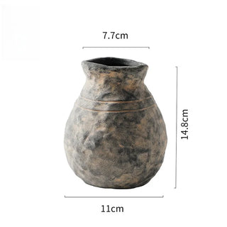 The Alma Clay Vase, made from stoneware clay, adds rustic charm with its textured finish and organic shape. Featuring uneven edges for a beautifully raw, simple design, this decorative accessory is perfect for displaying flower or branch arrangements. The Alma flower vase makes an elegant addition to shelves or consoles, enhancing natural home décor.