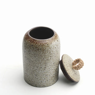 Minimalist countertop storage container in soft stone finish.