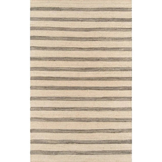 Handmade striped jute rug. featuring a simple natural and black stripe pattern. Natural flooring ideas. Natural and sustainable home rugs.