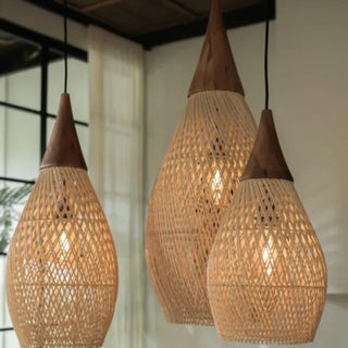 Natural rattan and teak pendant light with tear drop shape — handmade ceiling lamp for minimalist, boho or coastal interiors.