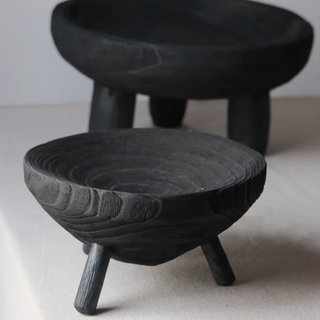 The Akira Wooden Deco Bowl, crafted from sustainable tung wood, features a rustic, raw design that adds harmony and balance to natural home décor. This handcrafted piece serves as both a decorative accessory and practical display item, creating an engaging centre piece for any space. It can also be used as a fruit bowl, tall ritual bowl or to display small trinkets.