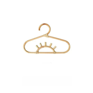 Handmade rattan clothes hangers for kids with woven boho design, nursery-sized and eco-friendly