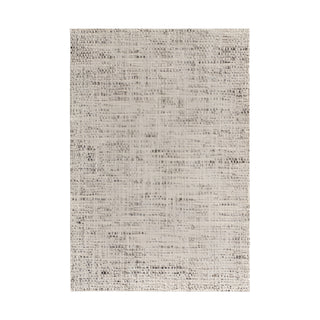 Natural wool area rug with earthy tones – the Suri handmade rug blends casual elegance with durability, making it perfect for bedroom and living room spaces. Suitable for contemporary, scnadi, wabi sabi and rustic interiors.