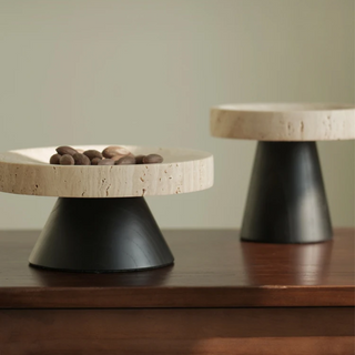 Elegant round pedestal display tray crafted from travertine and cedar wood, featuring a high foot stand for a sophisticated touch. Perfect for natural home décor, this versatile tray is ideal for showcasing ornaments, candles, or serving essentials with organic beauty