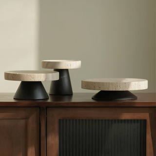 Elegant round pedestal display tray crafted from travertine and cedar wood, featuring a high foot stand for a sophisticated touch. Perfect for natural home décor, this versatile tray is ideal for showcasing ornaments, candles, or serving essentials with organic beauty