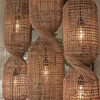 Handwoven Twister Abaca Pendant Light with open-bottom fish trap design and natural bark weave—artisan lighting with a coastal touch.