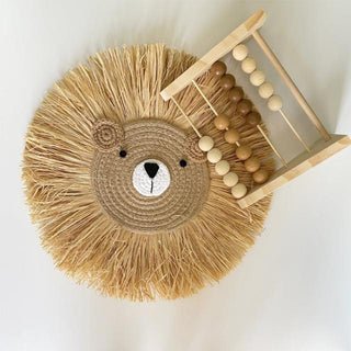 Handmade raffia lion wall decor with cotton rope face and natural straw mane, designed for nursery or children's room wall styling.