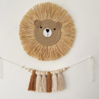 Handmade raffia lion wall decor with cotton rope face and natural straw mane, designed for nursery or children's room wall styling.