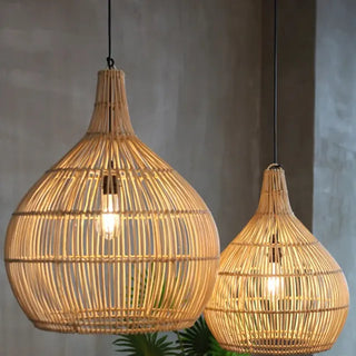 Handcrafted bamboo pendant light with tulip shape and neutral finish, ideal for boho and minimalist interiors.