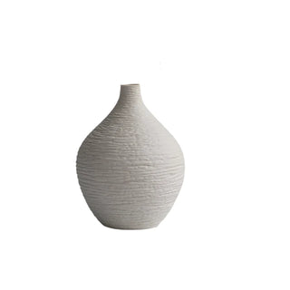 Modern ceramic flower white vases from the Emi Vases collection, featuring a sleek, minimalistic design with ribbed texture. Crafted from high-quality ceramic, these vases enhance contemporary, minimal or scandi home décor with their sculptural elegance. Perfect for displaying as a standalone piece or grouped together on a shelf or console, they add sophistication and refinement to any room.