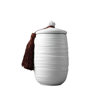 Elegant white ceramic large storage jars in various shapes and sizes, featuring a ribbed textured finish and airtight lids. Perfect for storing tea, coffee, sugar, and spices while adding a modern, sophisticated touch to any kitchen countertop.