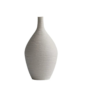Modern ceramic flower white vases from the Emi Vases collection, featuring a sleek, minimalistic design with ribbed texture. Crafted from high-quality ceramic, these vases enhance contemporary, minimal or scandi home décor with their sculptural elegance. Perfect for displaying as a standalone piece or grouped together on a shelf or console, they add sophistication and refinement to any room.