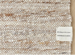Anvi handmade wool and linen rug in beige earthy tones, featuring a bubbly textured surface - ideal for Scandi, minimalist, or modern interiors.
