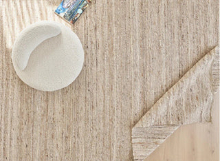 Anvi handmade wool and linen rug in beige earthy tones, featuring a bubbly textured surface - ideal for Scandi, minimalist, or modern interiors.