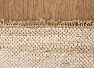 Anvi handmade wool and linen rug in beige earthy tones, featuring a bubbly textured surface - ideal for Scandi, minimalist, or modern interiors.