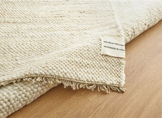 Anvi handmade wool and linen rug in beige earthy tones, featuring a bubbly textured surface - ideal for Scandi, minimalist, or modern interiors.