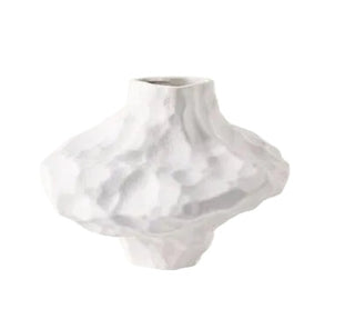 White ceramic vase with asymmetric sculptural form and matte texture