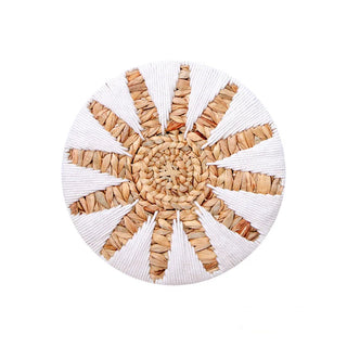 White and natural round woven wall basket for boho and coastal interiors
