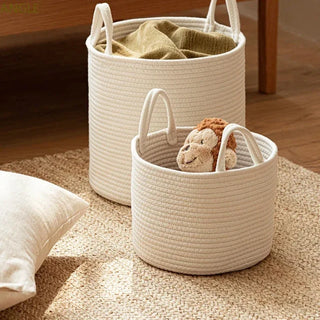 Small and large white cotton rope storage basket with handles for storing toys, towels and laundry.
