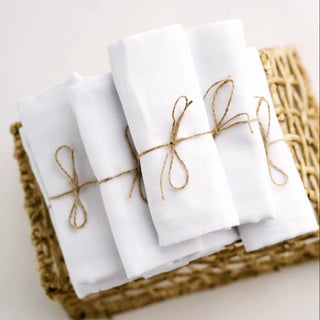 Handmade white cotton napkins with soft natural texture.