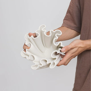 Fluted decorative white ceramic centrepiece.