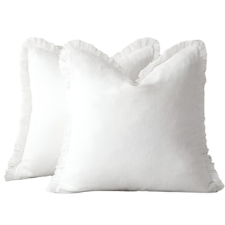 White fringed cushion covers, made from 100% natural linen cotton blend for a soft and breathable feel. Featuring elegant ruffled edges, these timeless cushion covers are available in two sizes for flexible styling in any home décor.