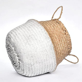 Handwoven natural and white seagrass storage basket with handles, perfect as a stylish hanging basket, pot planter, or decorative storage solution. This eco-friendly, two-tone basket adds a touch of natural home décor while keeping your space organized. Shop handcrafted storage baskets at our natural homeware store.