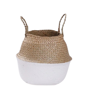 Handwoven natural and white seagrass storage basket with handles, perfect as a stylish hanging basket, pot planter, or decorative storage solution. This eco-friendly, two-tone basket adds a touch of natural home décor while keeping your space organized. Shop handcrafted storage baskets at our natural homeware store.