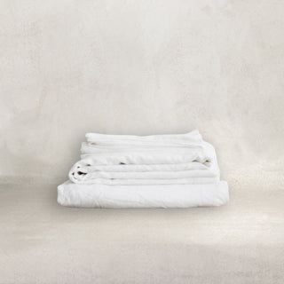 White pure linen bedding set, includes flat and fitted sheets and two pillowcases. Natural pre-washed flax linen bedding, textured and soft, ideal for year-round comfort. Perfect for modern, Boho, Scandinavian, and wabi-sabi bedroom styles.