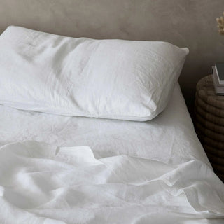 White pure linen bedding set, includes flat and fitted sheets and two pillowcases. Natural pre-washed flax linen bedding, textured and soft, ideal for year-round comfort. Perfect for modern, Boho, Scandinavian, and wabi-sabi bedroom styles.