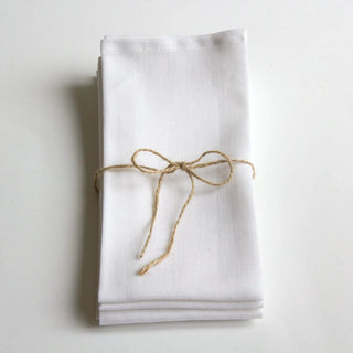 White linen table napkins for an elegant table setting.