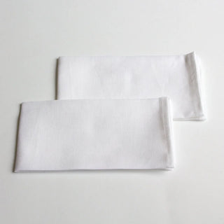 Set of 2 white linen table napkins for an elegant table setting.
