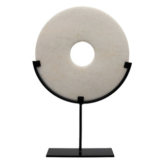 A stunning Marble Disc Ornament carved from elegant white marble, featuring a polished, unique disc displayed on a sleek metal frame. This sophisticated home décor piece adds a touch of luxury to any space, perfect for side tables or consoles. Ideal for creating a stylish focal point, it enhances interiors with its elegant design and timeless appeal. A beautiful addition to modern, minimalist, or contemporary décor.