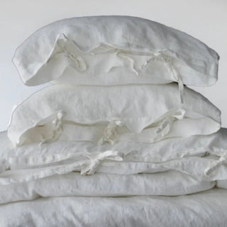 White linen bedding set with tie closures, perfect for a modern, minimalist, boho or scandi bedrooms.