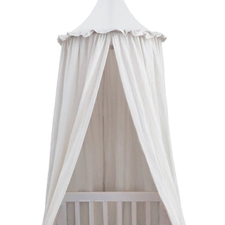 White cotton nursery canopy with a conical top and draped fabric, ideal for creating a cosy reading nook or dreamy play space in a child's room.