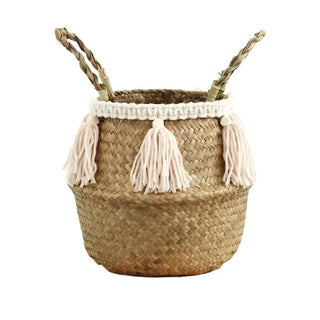 Handwoven natural seagrass storage basket with handles, perfect as a stylish hanging basket, pot planter, or decorative storage solution. This eco-friendly basket, adorned with charming tasselled fringe, adds a natural boho touch while keeping your space organized. Shop handcrafted storage baskets at our natural homeware store.