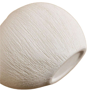 White textured ceramic vase with a minimalist design, available in two colours that can be styled together. The vase features a creative, organic pebble shape and a sleek white matte finish, perfect for adding a bold, statement look to any modern or contemporary interior.