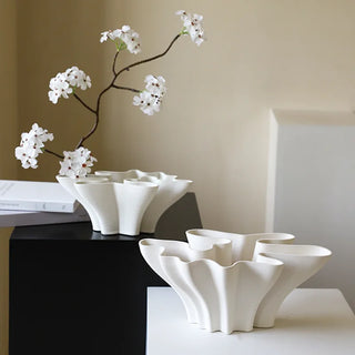 Modern white ceramic vase available in two sizes.