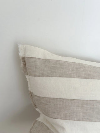Decorative striped linen cushion for modern and rustic interiors.