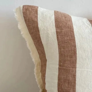 Striped decorative cushion for relaxed, natural interiors.