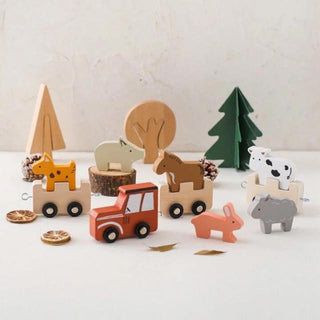 Wooden Montessori farmyard pull-along toy with animal figures and nesting shapes, designed for toddler learning and play.